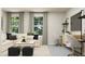 Bright office space with a large sectional sofa and a work desk at 313 Whispering Way, Sanford, NC 27330