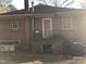 Brick house exterior with back door and small patio at 308 E East End Ave, Durham, NC 27703