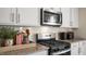 Stainless steel appliances and granite countertops highlight this kitchen at 6429 Alfalfa Ln, Wake Forest, NC 27587