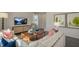 Bright living room with comfy seating and large windows at 6429 Alfalfa Ln, Wake Forest, NC 27587