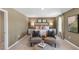 Bright bedroom with two armchairs and a large bed at 6429 Alfalfa Ln, Wake Forest, NC 27587