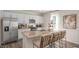 Modern kitchen with white cabinets, granite countertops, and stainless steel appliances at 6429 Alfalfa Ln, Wake Forest, NC 27587