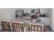 Kitchen island with granite countertop and seating for three at 6429 Alfalfa Ln, Wake Forest, NC 27587