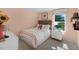 Cozy bedroom with striped bedding and a cheerful sunflower vase at 6429 Alfalfa Ln, Wake Forest, NC 27587