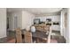Bright dining room with dark wood table and wicker chairs at 6429 Alfalfa Ln, Wake Forest, NC 27587