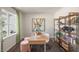 Home office with a desk, shelving unit, and natural light at 6429 Alfalfa Ln, Wake Forest, NC 27587