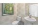 Stylish powder room with pedestal sink and unique patterned wallpaper at 6429 Alfalfa Ln, Wake Forest, NC 27587