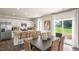 Kitchen and dining area combo with sliding glass doors leading to the backyard at 6429 Alfalfa Ln, Wake Forest, NC 27587