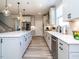 Modern kitchen with stainless steel appliances and an island at 15 S Brookhollow Way, Clayton, NC 27520