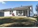 Two-story house with a screened porch and landscaped yard at 15 S Brookhollow Way, Clayton, NC 27520