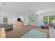 Finished basement with sectional sofa, wet bar, and workspace at 90118 Hoey, Chapel Hill, NC 27517