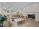 Sunroom features a fireplace, large windows, and comfortable seating area at 90118 Hoey, Chapel Hill, NC 27517