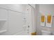 Clean bathroom with a tub, shower, and built-in shelves at 316 Leven Dr, Gibsonville, NC 27249