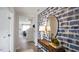 Entryway with a console table and blue patterned wall at 316 Leven Dr, Gibsonville, NC 27249