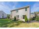 Gray house with a backyard, landscaping, and trees at 316 Leven Dr, Gibsonville, NC 27249