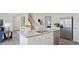 Modern kitchen with island and stainless steel appliances at 316 Leven Dr, Gibsonville, NC 27249
