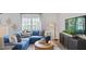 Cozy living room with sectional sofa and large TV at 316 Leven Dr, Gibsonville, NC 27249