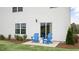 Private patio with blue chairs and small table at 316 Leven Dr, Gibsonville, NC 27249