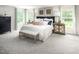 Bright main bedroom with a king-size bed and ample closet space at 8837 Tartan Clan Dr, Willow Springs, NC 27592