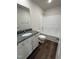 Bathroom with granite vanity, bathtub, and dark brown flooring at 378 Magnolia Run Way, Benson, NC 27504