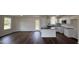 Modern kitchen with white cabinets, granite countertops, and island at 378 Magnolia Run Way, Benson, NC 27504