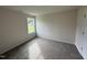 Bright bedroom with carpeted floor and large window at 378 Magnolia Run Way, Benson, NC 27504