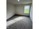 Simple bedroom with carpeted floor and a window at 378 Magnolia Run Way, Benson, NC 27504