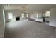 Open living room showcasing a fireplace and kitchen with an island at 378 Magnolia Run Way, Benson, NC 27504
