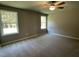 Bright bedroom with two windows and carpet at 79 Tulipfield Way, Benson, NC 27504