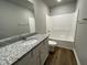 Bathroom with granite countertop and bathtub at 79 Tulipfield Way, Benson, NC 27504