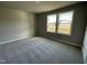 Spacious bedroom with carpet and two windows at 79 Tulipfield Way, Benson, NC 27504