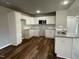 Modern kitchen with white cabinets and granite countertops at 79 Tulipfield Way, Benson, NC 27504