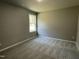 Cozy bedroom with a window and carpet flooring at 79 Tulipfield Way, Benson, NC 27504