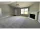 Bright living room features a fireplace and new carpet at 79 Tulipfield Way, Benson, NC 27504
