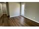 Bright bedroom with hardwood floors and door leading to the outside at 79 Tulipfield Way, Benson, NC 27504