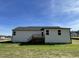 White house exterior with deck and grassy yard at 79 Tulipfield Way, Benson, NC 27504