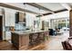 Modern kitchen with wooden accents, a large island, and high-end appliances at 017 Bartley Holleman Rd # 17, New Hill, NC 27562