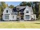 Two-story white brick home with black windows and a large front yard at 017 Bartley Holleman Rd # 17, New Hill, NC 27562