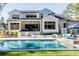 Luxury home with a large pool, patio, and outdoor kitchen at 017 Bartley Holleman Rd # 17, New Hill, NC 27562