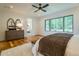 Charming bedroom with hardwood floors and a view to the backyard at 013 Bartley Holleman Rd # 13, New Hill, NC 27562