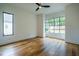 Spacious bedroom with hardwood floors and a large window offering natural light at 013 Bartley Holleman Rd # 13, New Hill, NC 27562