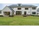 Back of house with patio, water feature, and lawn at 013 Bartley Holleman Rd # 13, New Hill, NC 27562