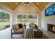 Relaxing outdoor space with fireplace, seating area, and views of the backyard at 013 Bartley Holleman Rd # 13, New Hill, NC 27562