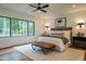 Comfortable bedroom with hardwood floors and large window at 013 Bartley Holleman Rd # 13, New Hill, NC 27562
