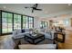Open living room with large windows and hardwood floors at 013 Bartley Holleman Rd # 13, New Hill, NC 27562
