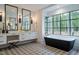 Elegant bathroom featuring a freestanding tub and patterned tile floor at 013 Bartley Holleman Rd # 13, New Hill, NC 27562