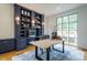 Bright home office features built-in shelves and a large window at 013 Bartley Holleman Rd # 13, New Hill, NC 27562