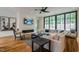 Comfortable living room with a modern fireplace and large windows at 013 Bartley Holleman Rd # 13, New Hill, NC 27562