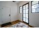 Bright entry with wood floors, a coat closet, and French doors leading outside at 013 Bartley Holleman Rd # 13, New Hill, NC 27562