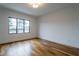 Bright bedroom with hardwood floors and a window offering wooded views at 013 Bartley Holleman Rd # 13, New Hill, NC 27562